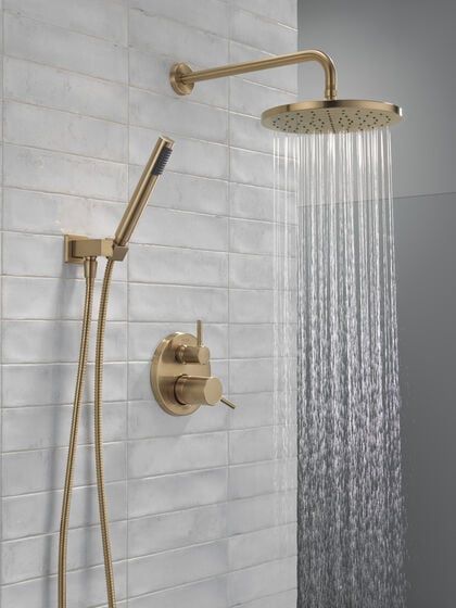 Monitor® 14 Series Shower with Raincan, Hand Shower & Rough Valve in Champagne Bronze 342702-CZ | Delta Faucet Moen Shower Heads, Delta Trinsic Shower System, Primary Bathroom Gold Fixtures, Antique Bronze Shower Fixtures, Gold Bathroom Shower Fixtures, Delta Gold Shower Fixtures, Sink Hardware Bathroom, Gold Shower Fixtures Master Bath, Brushed Gold Shower System