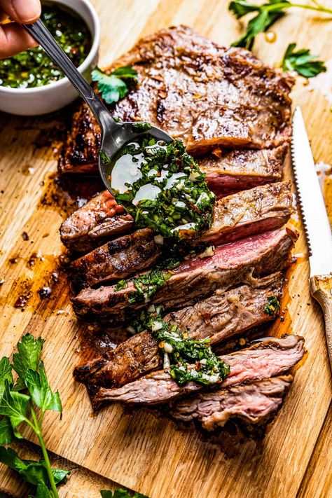 Get ready for an explosion of flavor! This churrasco steak is marinated in a savory-sweet, garlicky sauce, seared to perfection, and served with a bright, spicy chimichurri. Yum! Churrasco Steak, Flank Steak With Chimichurri, Flank Steak Chimichurri, Steak With Chimichurri, Steak With Chimichurri Sauce, Marinated Flank Steak, Chimichurri Recipe, Grilled Flank Steak, Chimichurri Sauce