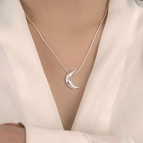 New in: Our Crescent Moon Silver Pendant ✨🌙 Inspired by the beauty of the night sky, this crescent moon pendant is crafted to add a touch of elegance to your everyday style. Whether you’re dressing up for an evening out or adding a subtle glow to your daily look, this piece brings celestial charm to any outfit. 🌙 💎 Shop now and embrace the magic in the details! . Moon pendant | jewellery | stainless steel | necklace | Crescent Moon Pendant, Outfit Shop, The Night Sky, Steel Necklace, Moon Pendant, Stainless Steel Necklace, Daily Look, Crescent Moon, Everyday Style