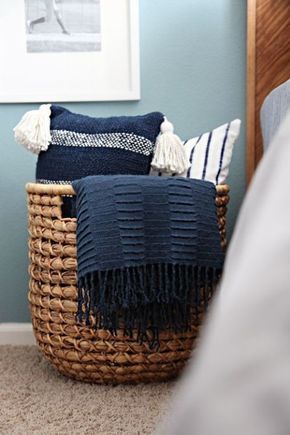 A wicker catch-all adds a rustic touch to a bedroom and creates an instant way to store pillows with ease. If you get one that's big enough, you can add throw blankets to the basket as well. Click through for more on this and other bedroom throw pillow storage ideas. Small Bedroom Organization, Small Bedroom Storage, Rustic Baskets, Pillow Storage, Apartment Storage, Throw Pillows Bedroom, Shabby Chic Bedroom, Blanket Storage, Chic Bedroom