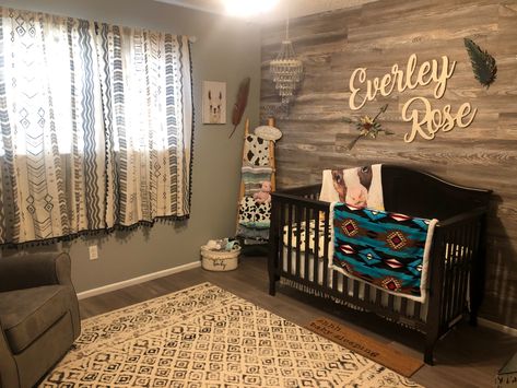 Wood accent wall. Western baby girl nursery. Corner chandelier. Blanket Ladder. Daughter Nursery Ideas, Western Nursery Ideas Farmhouse, Western Mountain Nursery, Nursery Ideas Western Theme, Country Baby Nursery Ideas, Baby Girl Nursery Western Theme, Baby Girl Country Nursery, Western Theme Nursery Girl, Rustic Baby Room Ideas