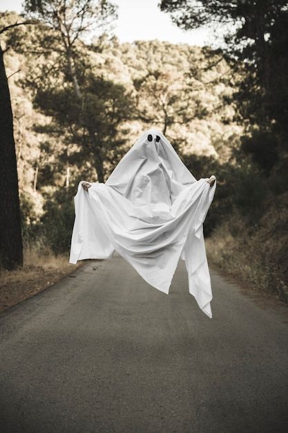 Human in gloomy ghost costume flying abo... | Free Photo #Freepik #freephoto #halloween #camera #road #forest Sheet Ghost, Ghost Photography, Halloween Photography, Vintage Halloween Costume, Ghost Costume, Dp Images, Ghost Pictures, Ghost Photos, Halloween Photoshoot