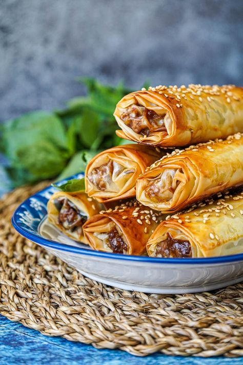 Side view of a stack of Thai Basil Chicken Phyllo Rolls with basil in the background. Phyllo Dough Egg Rolls, Chicken Phyllo Recipes, Phylo Pastry Appetizers, Phyllo Dough Recipes Dinner, Chicken Phyllo, Phyllo Appetizers, Phyllo Rolls, Philo Dough, Puff Pastry Chicken