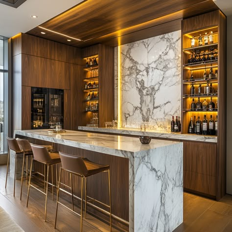 A sleek home bar with marble countertops and custom wood cabinetry, featuring backlit shelving that showcases an elegant collection of spirits. The design is both modern and luxurious, ideal for stylish entertaining. Modern Luxury Bar Designs For Home, Modern Classic Bar Design, Tabletop Bar Ideas, Modern Bar Designs For Home, Home Bar With Fireplace, Elegant Home Bar Ideas, Modern Bar In House, Home Dry Bar Designs, Bar Inspo Home