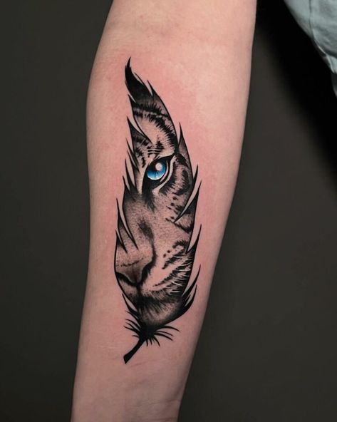 Enchanting Feather Tattoo: Eye of a Bird within Delicate Wings 2 Feathers Tattoo, Feather Tattoo Art, Feather Tattoo Placement, Rasta Tattoo, Animal Tattoo Designs, Tiger Hand Tattoo, Forearm Cover Up Tattoos, Tiger Eyes Tattoo, Feather Tattoo Meaning