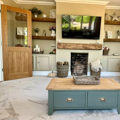 With a whole house to makeover, Sheree Pipe is understandably very proud of her living room - "I’m so happy with my DIY shelves, they turned out exactly as I’d hoped! 😍" Stunning fireplace and chimney breast wall transformation! 🙌 Paint: Farrow & Ball 'Oxford Stone' Shelves & mantel: Sleepers from local garden centre, cut down, sanded & waxed Cabinets & moulding: Howdens Wicker baskets: Dot and Blush #diy #onabudget #fireplace #chimneybreast #alcoves #shelving #builtins #farrowandball #howde... Chimney Breast Shelving, Wall Wooden Shelves, Brick Chimney Breast, Wall Transformation, Alcove Shelving, Cabinet Molding, Lounge Inspiration, Brick Chimney, Chimney Breast