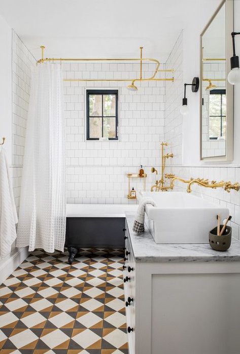 A bold tile in a fun pattern can often make the other parts of a space pop - like the brass and black accents of this bathroom! + freestanding tub + brass faucet + wall mount faucet + ceiling mounted shower curtain rod | Design by Anderson Wier Studio Kids Bathrooms, Clawfoot Tub Shower, Style Me Pretty Living, Elegant Living Room Decor, The World Of Interiors, Freestanding Tub, Tub Shower, Clawfoot Tub, Tile Shower