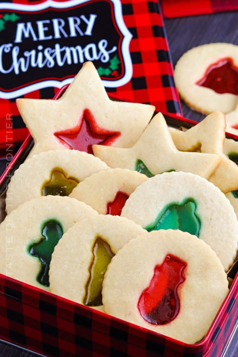 If you're looking for holiday cookies that are pretty and impressive, look no further than these easy stained glass cookies. Christmas Cookie Frosting, Christmas Cookies And Candy, Christmas Cookie Exchange Recipes, Glass Cookies, Chocolate Marshmallow Cookies, Stained Glass Cookies, Cookie Exchange Recipes, Whipped Shortbread Cookies, Delicious Christmas Desserts