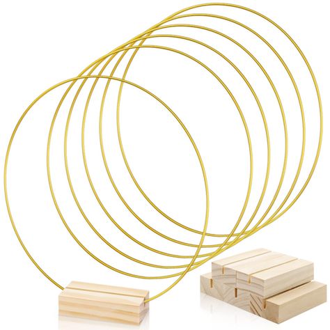 PRICES MAY VARY. Package Includes: You will receive 5 pieces of golden metal rings with 5 pieces wood place card holder in the package, enough for you to decorate your wedding, engagement, party. Size: The gold round metal hoops is about 10 inches in diameter and the wood place card holders is 2.75 x 1.38 x 0.7 inch / 7 x 3.5 x 1.8 cm. High Quanlity: The metal hoop is made of sturdy metal, each thickness is 3mm. They do not deform or break easily. This wooden stand is made from natural wood, and Centerpiece With Metal Ring, Gold Hoop Centerpiece Diy, Hoop Centerpiece, Gold Ring Arch Wedding, Table Decorations For Wedding, Metal Ring Crafts, Simple Round Table Wedding Decor, Metal Hoop Centerpiece Wedding Diy, Gold Hoop Wreath Centerpieces