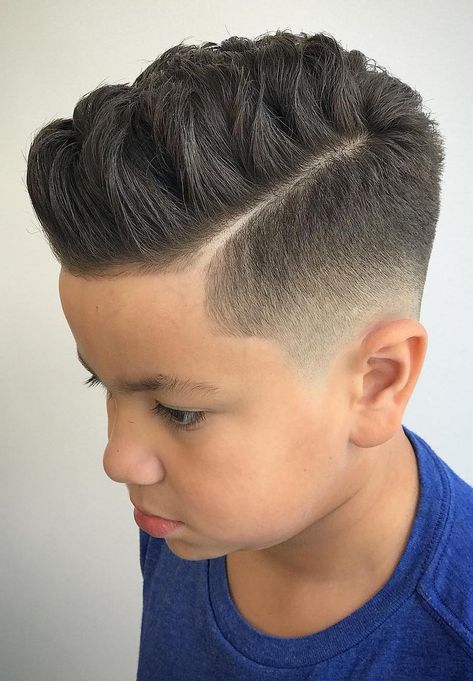 Finger Styled Top with Low Skin Fade - Fades aren’t as complicated as they look. Start by trimming the sides with a medium-length attachment, and gradually go for shorter and shorter attachments trimming progressively lower. For the line, use a clean straight edge. Trendy Boys Haircuts, Boys Fade Haircut, Boys Haircut Styles, Boy Haircuts Short, Cool Boys Haircuts, Boy Haircuts Long, Comb Over Haircut, Toddler Boy Haircuts