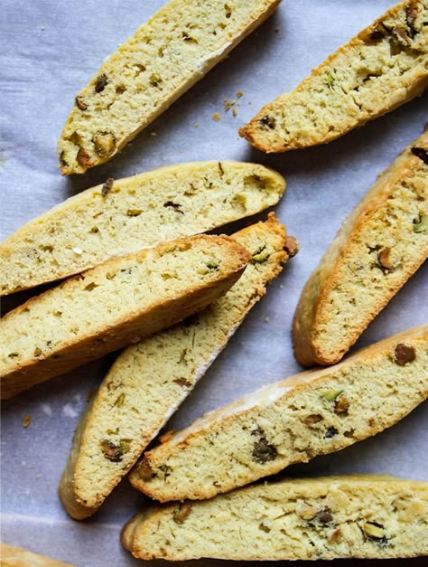 Italian biscotti cookies are twice baked, crunchy, and taste great when dunked in a hot coffee. These cookies are crunchy yet soft on the inside! Italian orange pistachio biscotti cookies are crunchy on the outside with a softer inside and practically melt in your mouth when they are dipped in your morning coffee! You'll love how simple this recipe is and how everyone will love enjoying these tasty biscottis dipped in their favorite warm drink. Italian Biscotti Recipe, Orange Biscotti, Backyard Bohemian, Orange Pistachio, Vinegar Recipes, Italian Biscotti, Pistachio Biscotti, Mediterranean Quinoa Salad, Perfect Pantry