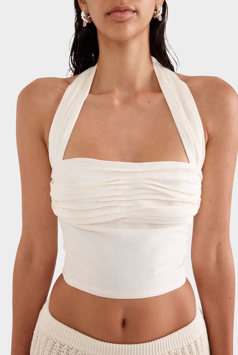 The Silk Linen Halter Top in Off White is designed for warmer weather. Crafted from silk and linen featuring a fitted pleated bodice, halter neck and lining. Wear yours with a mini skirt. Fitted bodice Halter neck Pleated bodice panel and strap Zip opening at back Lined 55% Silk 45% Linen Gentle dry clean only Linen Halter Top, Skirt With Top, Linen Tshirts, Linen Jackets, Silk Linen, Pleated Bodice, Halter Tops, Silk Skirt, Short Jumpsuit