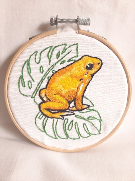 Hanmade embroidered of colombian golden poison dart/arrow frog Embroidered Frog, Colombia Art, Frog Embroidery, Hoop Wall Art, Poison Dart, Embroidery Hoop Wall, Embroidery Hoop Wall Art, Dart Frog, Thread Painting