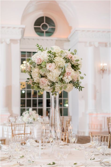 tall floral centerpieces with pink roses for winter wedding reception in East Brunswick NJ | Park Chateau winter wedding with pastel details in East Brunswick NJ photographed by Idalia Photography, New Jersey wedding photographer. Find inspiration for a romantic winter wedding here! Wedding Tall Flower Centerpieces, Pink Hydrangea Wedding Centerpieces, White And Pink Wedding Flowers Centerpieces, Tall Pink Floral Arrangements, Pink And White Hydrangea Centerpiece, Pink Flowers Wedding Centerpieces, White And Pink Floral Centerpieces, White Hydrangea With Pink Roses Centerpiece, White And Pink Centerpieces Wedding