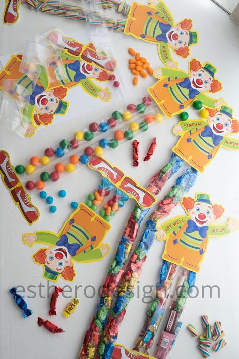 “Have a leg up” with these absolutely adorable, fun and sweet clowns. They're cute as a mishloach manos idea or a sign to display . In addition to the Simchas Purim Clowns in the photo,you'll notice some GET WELL QUICK clowns as well. After Purim your children can repackage their loads and loads of candy and send it to the less fortunate. Mishloach Manos Ideas, Crayon Cake, Mishloach Manot Ideas, Mishloach Manos, Mishloach Manot, Pinwheel Cookies, Party Setup, Chocolate Cookie Recipes, Off Game