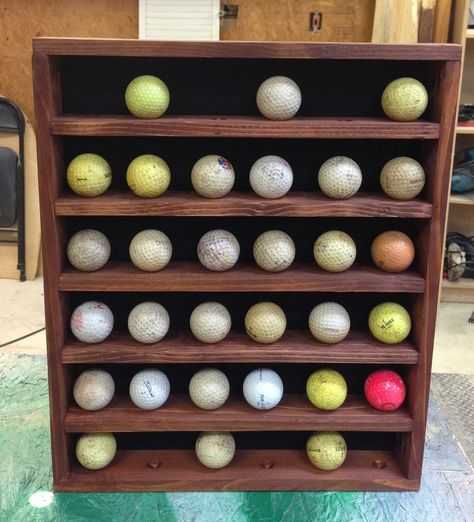 I have been busy making Christmas presents and I wanted to share what I made for my Dad. It didn’t come out as perfect as I was hoping, but I think he will still like it. Excuse the dirty golf balls, they were the only ones I could round up on short notice. As you can see … Golf Ball Display, Diy Golf, Golf Ball Display Case, Golf Birthday Gifts, Golf Ball Displays, Golf Ball Gift, Golf Ball Crafts, Ball Display, Ping Golf