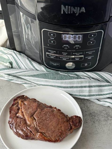 ​See how easy it is to cook a Ninja Foodi ribeye steak in the air fryer. Ninja Foodi ribeye steak is perfectly cooked and ready in minutes. Get the best air fried steak without the use heavy oils, and no need for an outdoor grill. Cook your ribeye with ease in the Ninja Foodi air fryer, pressure cooker, all in one appliance. No matter how you take your steak this step by step shows you how to cook a ribeye steak in an air fryer with ease. #ninjafoodisteak #airfryersteak #airfryerribeyesteak Ribeye In The Air Fryer, Ninja Foodi Ribeye Steak, How To Cook Steak In Air Fryer, Cross Rib Steak, Air Fryer Ninja Foodi, Air Fried Steak, Steak In The Air Fryer, Air Fryer Ninja, Air Fry Steak