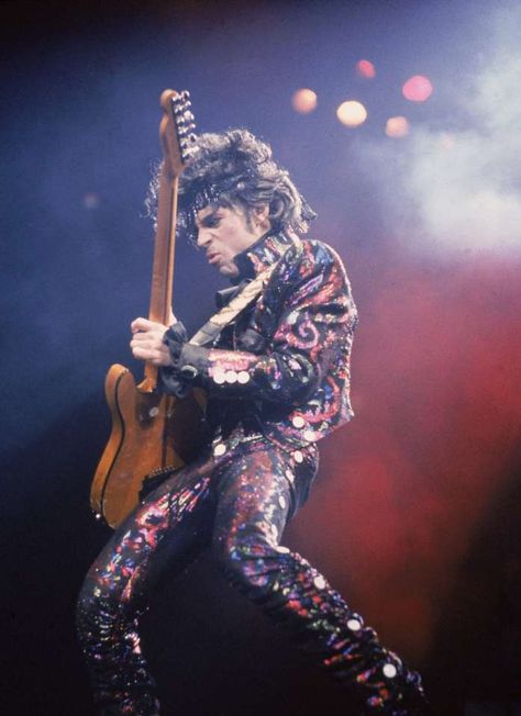 FILE - American rock singer and songwriter Prince plays guitar on stage during a concert, 1985. Purple Rain Prince, Music Lists, Rip Prince, Photos Of Prince, Simon Le Bon, Paisley Park, Rob Lowe, Prince Purple Rain, John Taylor