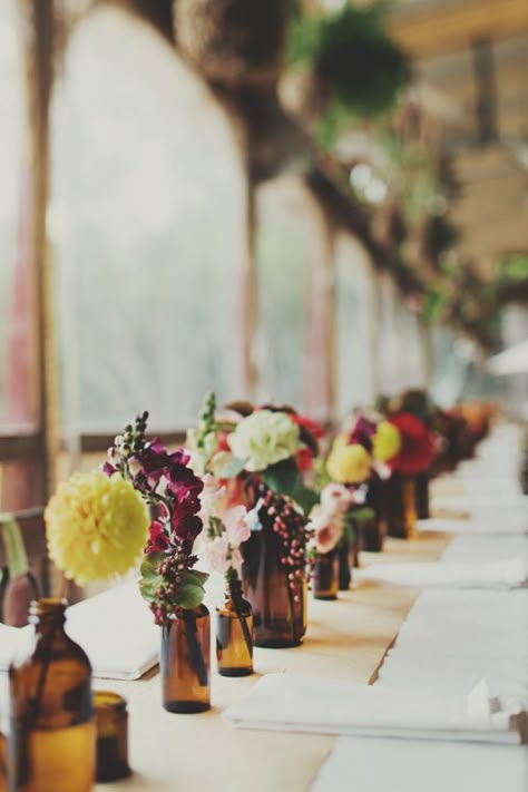 I used Blue Moon bottles, and flowers I purchased from Michael's, and they turned out awesome! Bottle Vases Wedding, Fake Flower Centerpieces, Boathouse Wedding, Beer Wedding, Bottle Centerpieces, Brown Bottles, Brown Wedding, Wedding Vases, Wedding Table Decorations