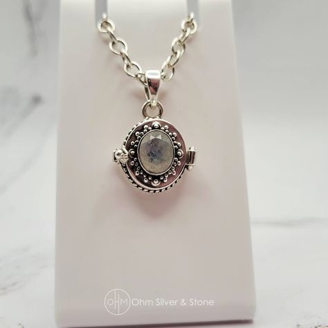 This enchanting moonstone locket, also known as a compartment locket, vessel pendant, or stash pendant, combines historical charm with modern elegance. Poison lockets have been used since ancient times to carry small amounts of perfume, herbs, or even secret messages. 💫 Pendant Details: Material: Stamped 925 sterling silver Stone: Moonstone, celebrated for its ethereal glow and adularescence, sourced from Sri Lanka, India, and Madagascar. Price: $120 CAD Compatibility: Also fits on popular ... Moonstone Locket, Secret Messages, Ancient Times, Modern Elegance, Madagascar, Sri Lanka, Locket, Handcrafted Jewelry, Moonstone