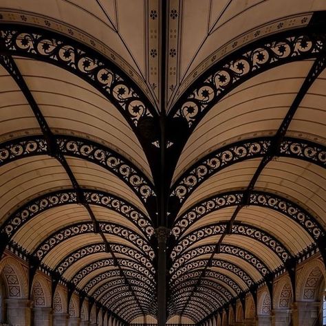 One Thousand Libraries 📖 on Instagram: "✨Welcome to the Sainte-Geneviève Library in Paris, France Nestled in the heart of Paris, stands as an enduring beacon of knowledge with its roots stretching back to the 5th century. Reimagined in the 19th century by Henri Labrouste, it holds a prestigious place in Parisian heritage, housing a vast collection of over 2 million books that attract book lovers from around the world. The library’s interior is an architectural marvel, with a stunning reading room characterized by Labrouste’s pioneering use of cast iron. The arched framework, adorned with delicate patterns, supports the expanse of the ceiling, while the alignment of tables crowned with iconic green lamps creates a symmetrical aesthetic of light and learning. The interplay of robust materi Raphael Metivet, Henri Labrouste, Green Lamps, Stretching Back, Paris Vibes, Green Lamp, Parisian Vibes, Parisian Life, The Architect