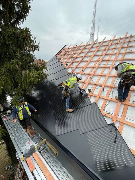 Smart Roofing2 Workers installing solar panels on a roof, part of a renewable energy project under construction. | Sky Rye Design Pv Panels Architecture, Solar Panel Roof Design, Spa Building, Solar Panel Shingles, Architecture Definition, Energy Efficient House, Solar Pergola, Architecture Schools, Solar Tiles