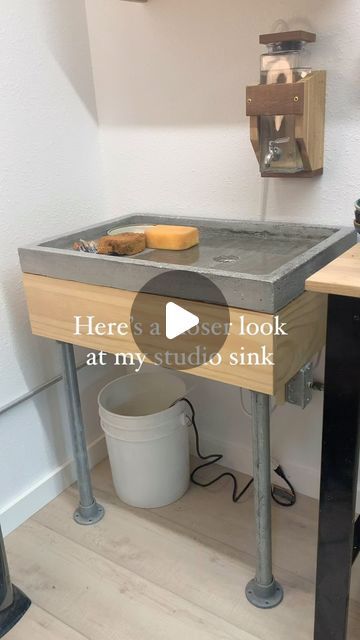 Erin Killian Pottery on Instagram: "My homemade sink has been a studio game changer! We don’t have ground water so this has been our solution. When I posted a mini video, I got a lot of questions, so here’s a closer look. My husband cast the cement and build the wooden base both for the sink and the water canister mounted to the wall. I hope this helps someone! #studio #artstudio #ceramicstudio #oppositesattract #potterystudio #organized #timesaver #organizedspace #organized #organizeyourlife #organizedliving #potterytools #sink #clean #homemade" Mini Pottery Studio, Pottery Sink, Clay Sinks, Water Canister, Kids Art Studio, Ground Water, Mini Video, Art Studio Room, Organized Living