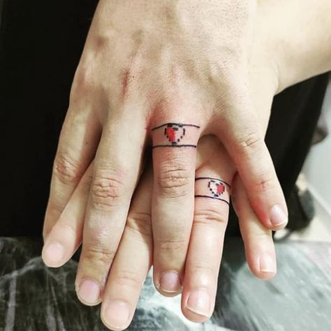 Pixel heart wedding ring tattoo Wedding Ring Tattoos For Couples, Heart Ring Tattoo, Ring Tattoos For Couples, Tatoo Ring, Geek Wedding Rings, Simple Couples Tattoos, Wedding Ring Tattoos, Marriage Tattoos, Ring Tattoo Designs