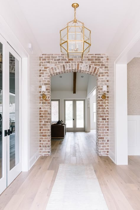 Brick Archway In Kitchen, Bayou House, Archways In Homes, Transitional Entry, Brick Archway, Home Entry, Brass Wall Sconces, Interior Brick, Farm Road