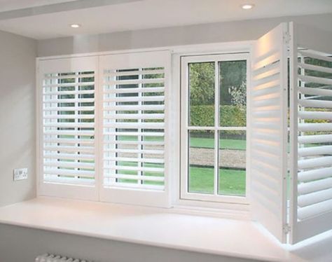 Learn the key differences between plantation shutters and California shutters. Find out which one is the best fit for your home decor and functional needs. Modern Window Shutters Indoor, Plantain Shutters With Curtains, Shutters For French Doors, Interior Shutter Ideas, California Shutters Living Room, Indoor Shutters For Windows, Large Window Shutters, Conservatory Shutters, White Shutters Living Room