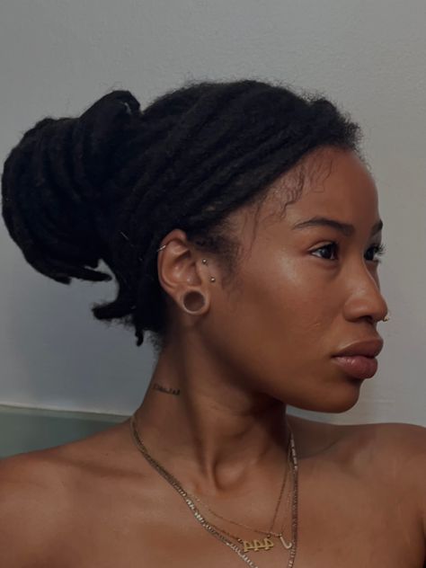 Black woman with locs Gauge Ears Black Women, Gauged Ears Black Women, Gauged Ears Women Aesthetic, Ear Gauges Aesthetic Black Women, Gauge Ears Women, Gauges On Black Women, Locs Tattoo Ink Black Women, Thick Short Locs Styles, Ear Gauges Black Women