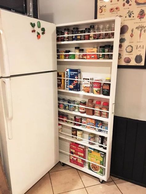 Give that space between your fridge and the wall a whole new purpose with this great storage cabinet hack. DIY hidden storage for your canned food! If you're short on space, it pulls out for easy access to whatever you need to store. diy | woodworking | storage cabinet | storage ideas, urban living, woodworking projects, Pulls out for easy access to canned goods etc Cabinet Above Refrigerator Storage, Beside Fridge Cabinet, Storage Around Fridge, Side Of Fridge Ideas, Above Refrigerator Storage, Cabinet Above Refrigerator, Apothecary Cabinet Diy, Side Of Fridge, Diy Pull Out Shelves