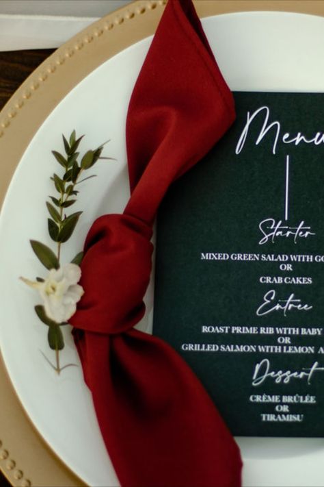 Black wedding menu, Crimson wedding napkin and Gold Wedding Decor Place Setting with a Touch of Green Red And Beige Wedding Decor, Ruby Red Gold And Black Wedding, Wedding Red And Green Theme, Red And Green Table Decorations, Black White Gold Maroon Wedding, Black And Red And Gold Wedding, Maroon And White Wedding Theme, Green Gold Red Wedding, Black White Red Green Wedding