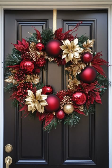 Festive holiday wreath with red and gold ornaments hanging on a black door. How To Make Holiday Wreaths, How To Decorate A Large Christmas Wreath, Christmas Wreaths Diy Ribbon, Easy Christmas Home Decor, Diy Christmas Wreath Ornaments, Christmas Door Wrap, Red And Gold Wreath Christmas, Diy Christmas Door Wreaths, How To Make Christmas Wreaths Diy