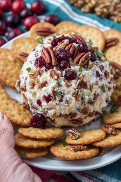 Delight your guests with this Cranberry Pecan Cheese Ball! Creamy, nutty, and fruity—a perfect holiday appetizer. Quick, easy, and delicious! #CheeseBall #HolidayAppetizer #EasyRecipes #Cranberry #Pecans Cheese Ball Recipes Pinapple, Cheese Ball With Cranberries, Pineapple Pecan Cheese Ball, Appetizers For Party Easy Finger Foods Christmas, Cranberry Pecan Cheese Ball Recipes, Pinecone Cheeseball Recipe, Cheeseball Recipes Easy, Christmas Cheese Ball Recipes, Cranberry Cheeseball