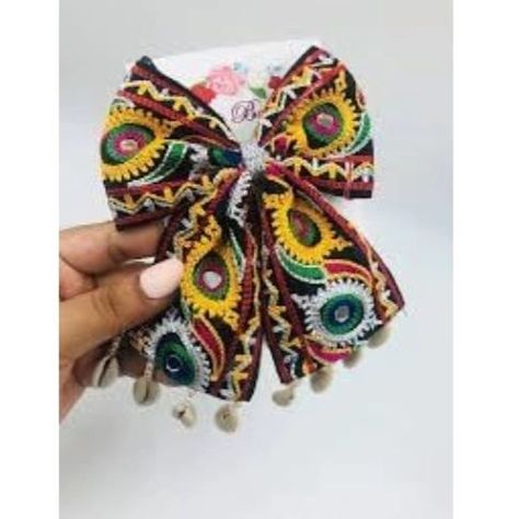 DM for product link‼️ Navratri Bows for womens and girls •Handcrafted Elegance: These vibrant bow ties are meticulously handcrafted, showcasing intricate embroidery with colourful thread patterns. •Unique Design: Each bow tie features a distinctive design with an eye-catching blend of red, yellow, green, blue, and silver embellishments. •Versatile Accessory: Suitable for formal occasions or to add a touch of flair to casual outfits, these bow ties are versatile fashion statements. #fashions... Navratri Bow, Dandiya Night, Navratri Collection, Bow Tie Hair, Tie Hair, Fashion Statements, Lace Hair, Intricate Embroidery, Bow Ties