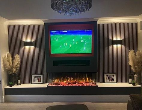 Fireplace Factory on Instagram: “BEAUTIFULLY BESPOKE 🔥 A perfectly designed media wall. Those acoustic panels with warm lighting give such a stunningly soft feature A…” Tv Media Wall Panneled, Slim Wall Fire With Tv Above, Media Wall With Wood Burner, Media Wall With Panelling, Acoustic Panel Media Wall, Fireplace Tv Wall Uk, Media Wall With Fireplace, Panoramic Fire Media Wall, Wall Unit Ideas