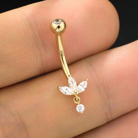 14K Solid Gold 14G flower Shape Belly Button Ring,Moissanite Diamond Lotus Belly Button Ring ,Curved Barbell,Navel Piercing Jewelry This elegant solid gold navel barbell features our largest invisible set lotus design, with no visible bezels or prongs, creating a floating effect on the skin. A delicate dangle adds a touch of movement and sophistication to the top of the navel, making this piece a perfect blend of elegance and modern style. --- IᑎᖴOᖇᗰᗩTIOᑎ ᗩᗷOᑌT ᑭᖇOᗪᑌᑕT --- ❖ Metal Type: 14K,18K Solid Gold ❖ Diamond Type: Moissanite ❖ Diamond Shape: Round Cut Diamond and Fancy Cut Diamond ❖ Diamond Size; 6mm or 9mm ❖ Diamond Color: G-H ❖ Diamond Clarity: VS ❖ Length: 5mm, 6.5mm, 8.00mm, 9.5mm, 11.00mm ❖ SKU: OSTJ257 "The size may differ depending on measurement methods." "The colour display Dangling Belly Button Piercing, Flower Belly Ring, Dainty Gold Belly Button Piercing, Belly Button Piercing Dangle, Dainty Belly Button Piercing, Belly Button Piercing Gold, Gold Belly Button Piercing, Belly Piercings, Navel Piercing Jewelry