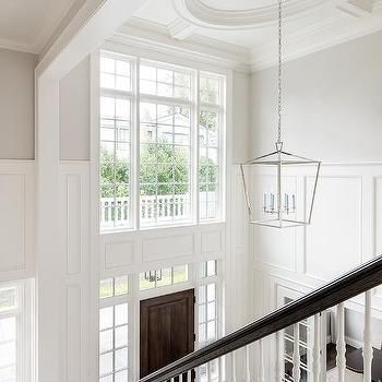 Two Story Foyer Design Ideas Dark Stained Wood Floors, White Marble Tile Floor, Trendy Paint Colors, Fox Group, White Staircase, 2 Story Foyer, Timeless Interior Design, White Marble Tiles, Two Story Foyer