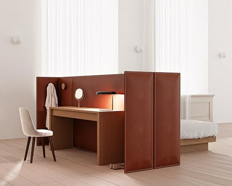 The Isola bed captures various moments of a day in a high-end craftwork, revealing a new typology of furniture that can be seen as a piece of architecture. As privacy is essential when comes the night, Isola is composed of a two sided leather headboard that plays a central part in the space layout. One side is dedicated to the bed, the other is open to the user’s choice : occasional desk, vanity table, dressing area, ... #design #desk #cuir #furniture #espritdesign Side Headboard Bed, Desk At Bed End, Desk Against Bed, New Classic Furniture Salon, Desk At End Of Bed, Bedroom Leather Headboard, Bed Side Desk, Dressing Area Design, Desk Headboard