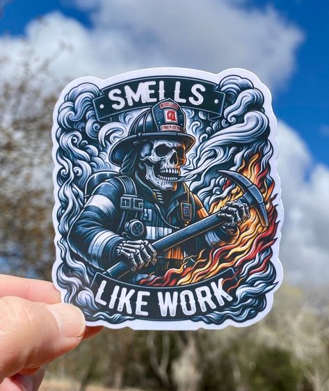 Introducing our Skeleton Firefighter Sticker: a fiery tribute to bravery! With smoke, flames, and the motto "Smells Like Work," this design comes in 4 striking variations. Perfect for those who tackle challenges head-on. Get ready to ignite inspiration and admiration wherever you stick these bold, dramatic decals! Available in 4 dramatic designs, or just get them all! Great for your water bottle, phone case, fridge, video game consoles, planner, locker, laptop or whatever else you put stickers o Firefighter Irons Tattoo, Firefighter Skeleton, Firefighter Skull, Firefighter Sublimation Designs, Firefighter Decals, Firefighter Stickers, Bunker Gear, Firefighter Art, Fire Training