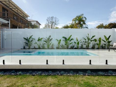 Clear Fence Ideas, Glass Around Pool, Pool With White Fence, Pool Area Ideas Australia, Pool Fence Ideas Australia, Aluminium Pool Fence, Aluminium Pool Fencing, Frameless Glass Pool Fence, Glass Pool Fence On Retaining Wall