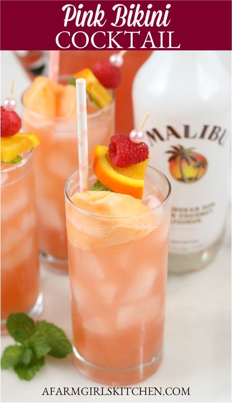 Pink Bikini Cocktails are a sweet and tropical tasting cocktail that is super easy to make and are perfect for your picnic or backyard gathering. This Easy Summer Cocktail is made with raspberry lemonade, coconut rum, amaretto, and topped with a scoop of orange sherbet.   #pinkbikinicocktail #cocktail #drinks #recipe #orangesherbet #maliburum #rum #summer Cocktails With Malibu Rum, Backyard Gathering, Easy Summer Cocktails, Malibu Coconut, Resep Smoothie, Orange Sherbet, Healthy Drink, Rum Drinks, Cocktail Sauce