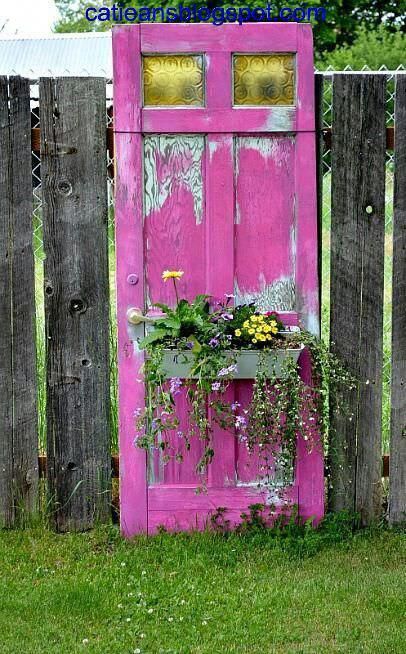 this old door painted this incredible color simply has a window box attached to the front, and is used as art in the garden. #gardenart Garden Diy Decoration Ideas, Driveway Fence, Salvaged Doors, Wood Pile, Doors Repurposed, Fence Landscaping, Pallet Garden, Outdoor Paint, Charming Garden