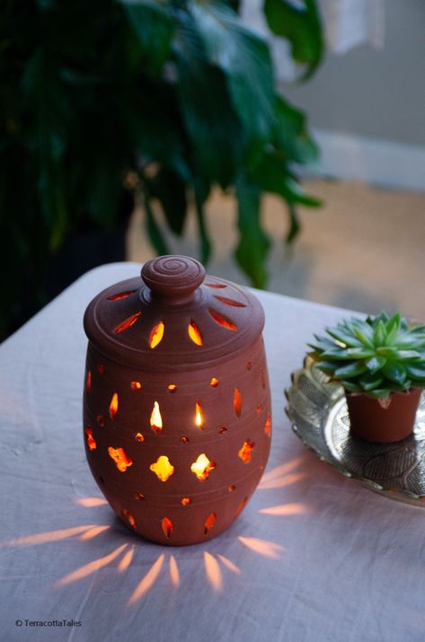 Handmade wheel thrown clay candleholder with beautiful cut-out pattern to give your space a bohemian touch! Be it your entryway or your zen corner, this unique candle holder is sure to give your home warm vibes with the beautiful pattern it creates. 100% natural & Eco-friendly, made with pure clay, and totally free of any toxic materials or lead. Perfect gift for any occasion! Dimensions 5.5 in Height (without lid) 7 in Height (with lid) 4.5 in Diameter at the widest. The TerracottaTales Edge Te Pottery Ideas Without Wheel, Thrown Ceramics Ideas, Terracotta Air Dry Clay Ideas, Terracotta Clay Crafts, Homemade Favors, Clay Candleholder, Terra Cotta Candle Holder, Zen Corner, Diy Crafts Easy At Home