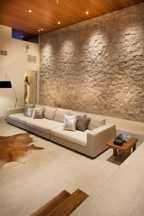 stone-wall-dining-room-wall-decor-ideas-beige-sofa-wooden-side-table Stone Wall Interior Design, Tv Fal, Stone Walls Interior, Modern Family House, Ceiling Design Living Room, Accent Walls In Living Room, Wood Ceiling, Stone Walls, Interior Wall Design