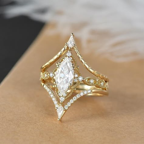 Vintage Marquise Cut Moissanite Engagement Ring Set 3pcs Yellow Gold Kite Moissanite Wedding Band Unique Proposal Ring Boho Ring Milgrain Engagement Ring: https://www.etsy.com/listing/1354873593 * Ring Material: solid 14k white gold, rose gold, or yellow gold  * Center Stone: 5x10mm, about 1ct(as pics shown)/6*12mm, about 2ct/7*14mm, about 3ct, Colorless Marquise Moissanite * Side Stone: Colorless Moissanite, lab diamond or natural diamonds , about 0.58ct * Bandwidth: 1.6mm More you may like: ht Wedding Ring Set Vintage, Marquise Wedding Ring, Gold Wedding Ring Set, Wedding Ring Sets Vintage, Milgrain Engagement Ring, Wedding Band Unique, Moissanite Engagement Ring Set, Cute Engagement Rings, Future Engagement Rings