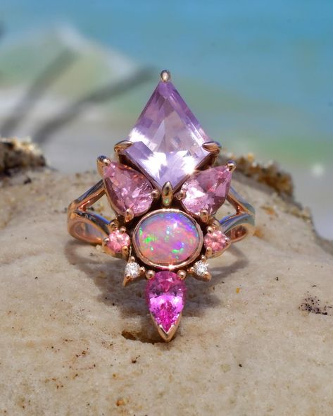 My July collection is live with 11 new Rings! Thank you for all of your wonderful feedback on this collection as it came to life! I’d love to hear what your favorite piece is! ☺️🥰 1) Group photo featuring 6 of my new pieces of the peachy pink and purple realm, including the mini rose gold Dipped in Moonlight Ring with diamonds (Sold) and a new Chevron shaped rose gold accent ring with sapphires arranged in a South Asian motif! 2) My newest piece! A two piece set made with a beautiful purpl... Alchemy Jewelry, Unicorn Ring, Lavender Opal, Fairy Ring, Lavender Quartz, Purple Rings, Rainbow Opal, Pink Spinel, Split Shank Ring