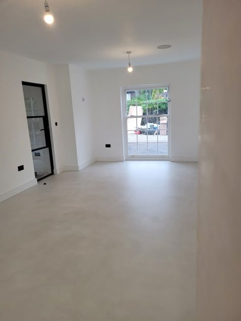 Beautiful effect to a large ground floor area, finished with satin sealer. Concrete White Floor, Concrete Floor Colors Living Room, Matte Concrete Floors, Matte Concrete Floors In House, Beige Concrete Floors, Micro Concrete Flooring, Cement Floor Basement, Limewash Concrete Floor, Concrete Floor Colors