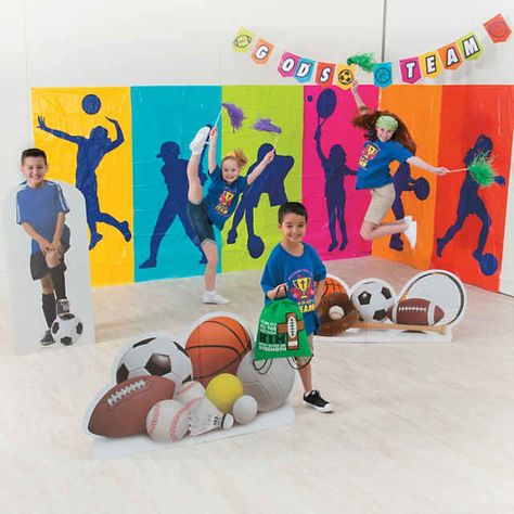 Large Sports Backdrop Banner - 6 Pc. | Oriental Trading Sports Backdrop Ideas, Sports Decorations School, Preschool Sports Theme, Olympic Vbs, Scenarios Ideas, Sports Day Banner, Sports Backdrop, Sports Vbs, Sports Day Decoration